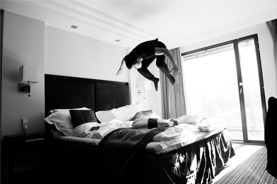 somersaults on the bed