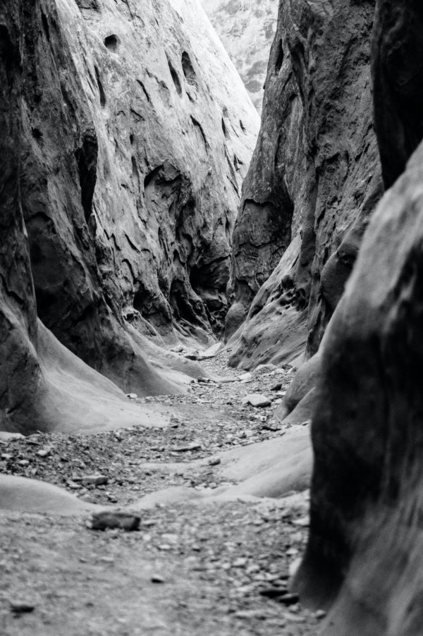 grayscale photo of pathway in middle of hills stockpack unsplash 600x902